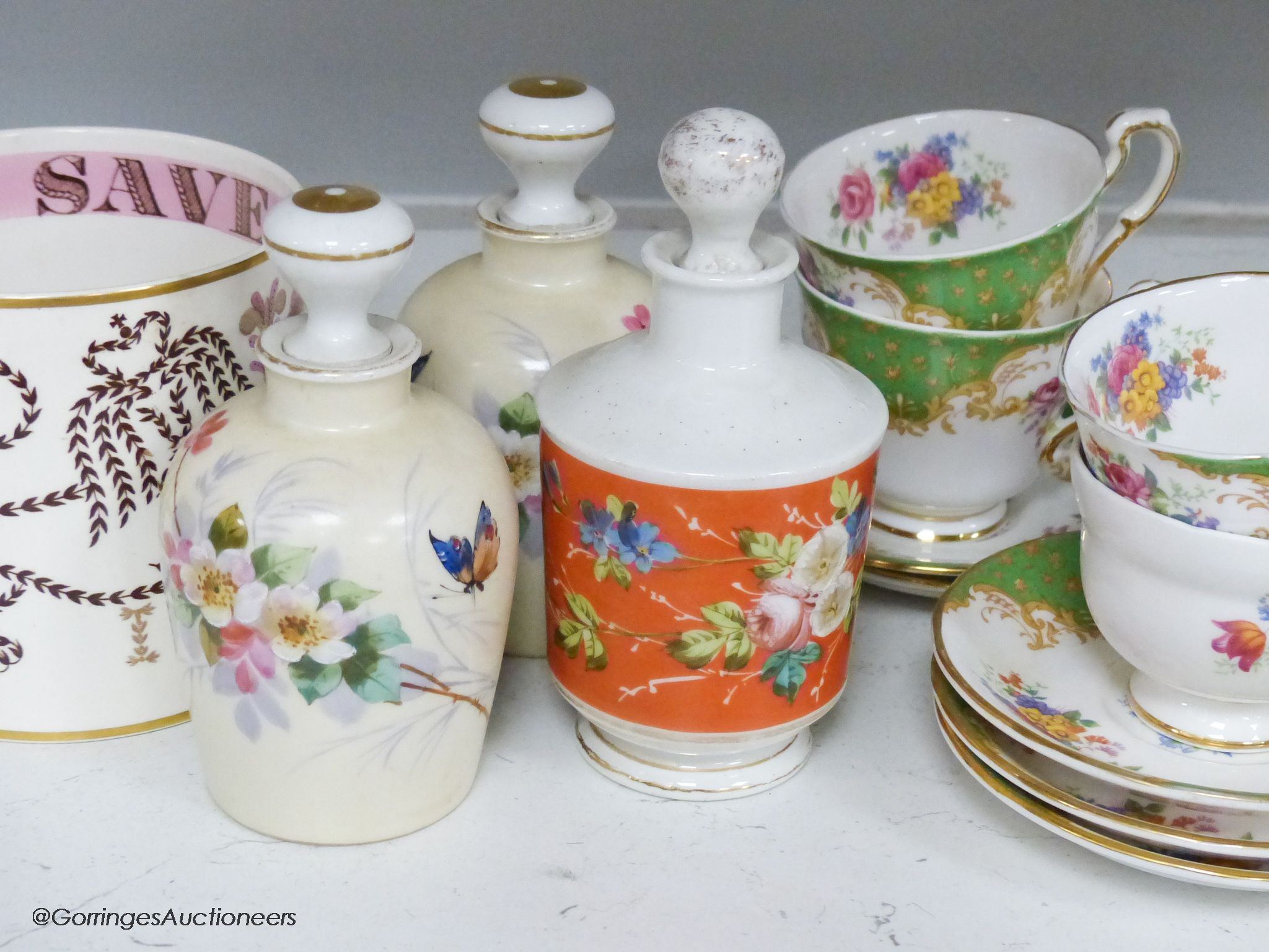 A Paragon tea set, three ceramic perfume bottles and stoppers and a Wedgwood commemorative mug